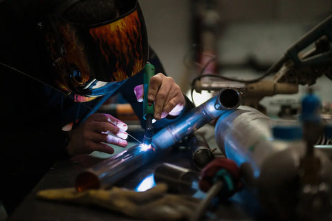 a welder is using TIG Welding function to weld